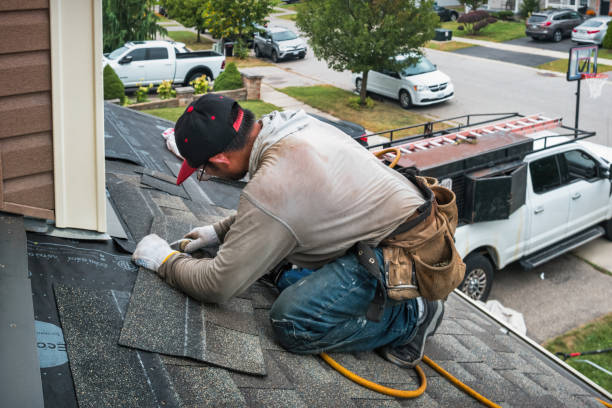 Professional Roofing technician working in Montebello, NY